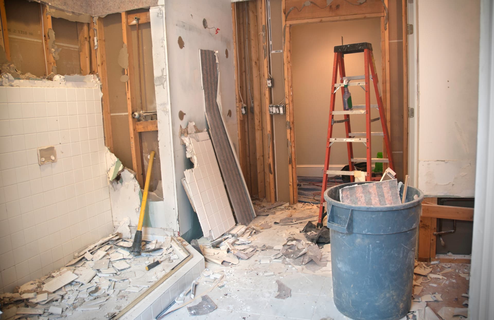 Interior stripped back to the studs with tile and drywall on the floor